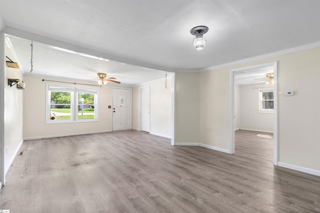 209 Edwards Rd, Lyman, SC 29365 - unfurnished living room featuring a ceiling fan, wood finished floors, and ornamental molding
