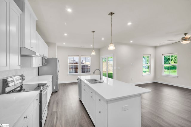 4 Inka Ct, Greenville, SC 29607 - kitchen with appliances with stainless steel finishes, dark wood-type flooring, a center island with sink, white cabinets, and light countertops