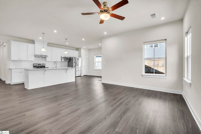 4 Inka Ct, Greenville, SC 29607 - unfurnished living room featuring a ceiling fan, dark wood-type flooring, and recessed lighting