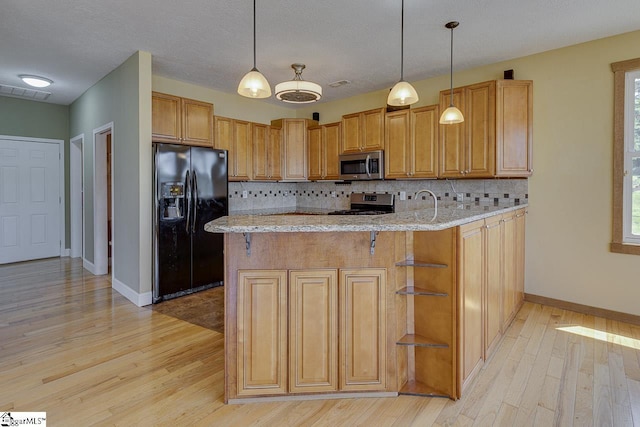 450 Johnson Ave, Anderson, SC 29621 - kitchen with stainless steel appliances, light wood-type flooring, light stone countertops, and tasteful backsplash
