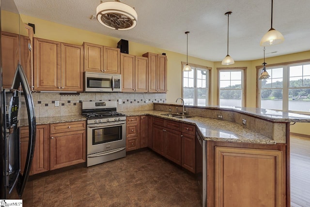 450 Johnson Ave, Anderson, SC 29621 - kitchen with appliances with stainless steel finishes, a water view, decorative backsplash, a peninsula, and light stone countertops