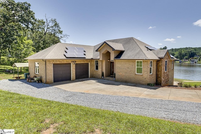 450 Johnson Ave, Anderson, SC 29621 - view of front of property with solar panels, an attached garage, brick siding, and concrete driveway