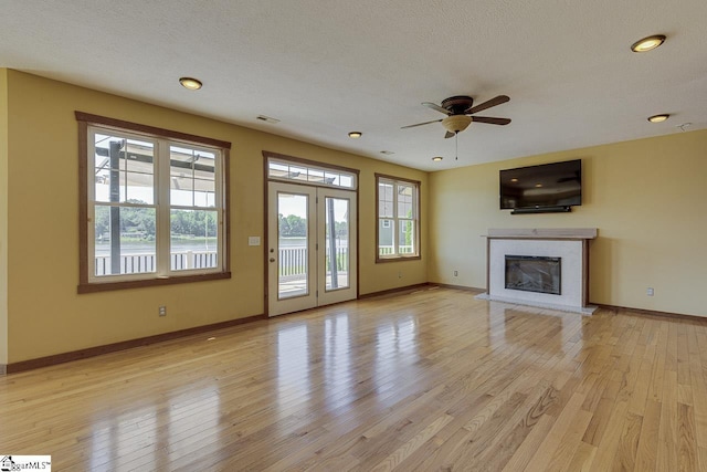 450 Johnson Ave, Anderson, SC 29621 - unfurnished living room with a premium fireplace, a ceiling fan, light wood-type flooring, and recessed lighting