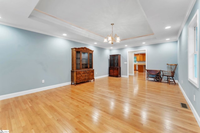 1 Moultrie Dr, Taylors, SC 29687 - living area featuring a raised ceiling, ornamental molding, a chandelier, light wood-type flooring, and recessed lighting