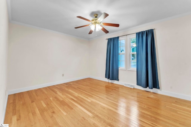 1 Moultrie Dr, Taylors, SC 29687 - spare room with light wood finished floors, ceiling fan, and crown molding