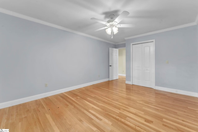 1 Moultrie Dr, Taylors, SC 29687 - unfurnished bedroom featuring crown molding, light wood-style flooring, a closet, and a ceiling fan