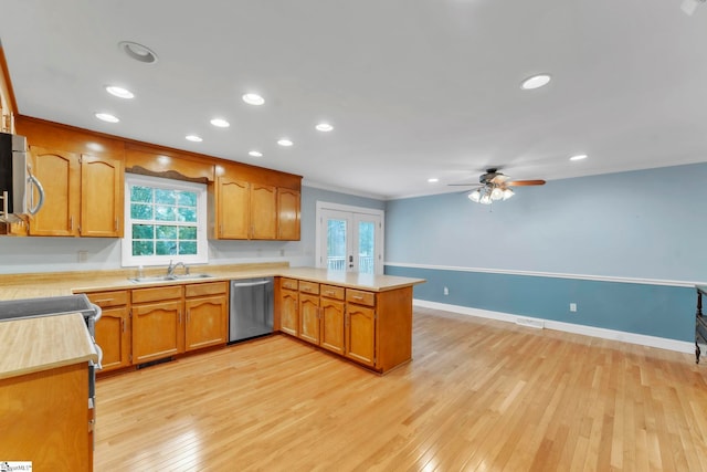 1 Moultrie Dr, Taylors, SC 29687 - kitchen featuring dishwasher, a peninsula, light countertops, light wood-style floors, and french doors