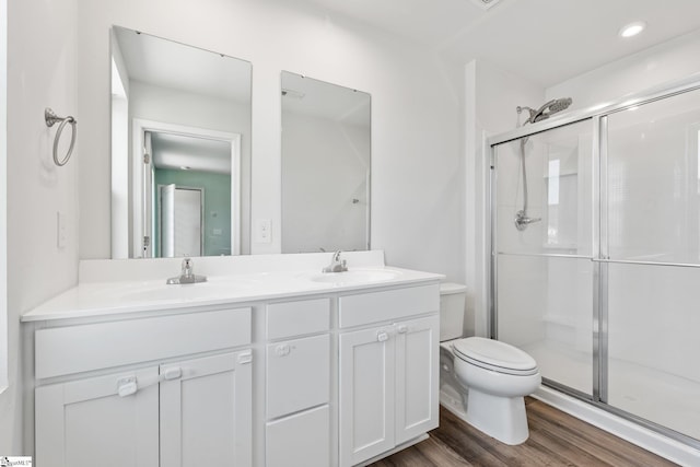 166 Bleckley Trl, Anderson, SC 29625 - bathroom featuring double vanity, a shower stall, and wood finished floors