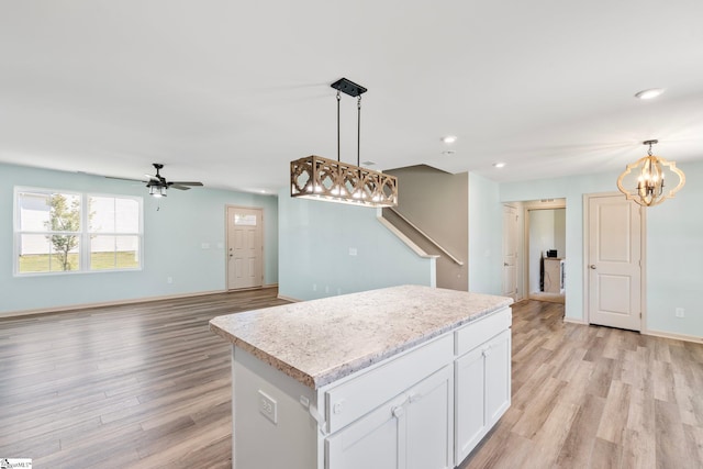 166 Bleckley Trl, Anderson, SC 29625 - kitchen with a chandelier, light wood finished floors, a kitchen island, decorative light fixtures, and recessed lighting