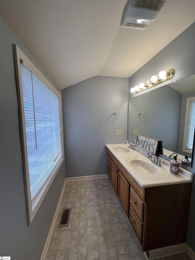 112 Garrison St, Easley, SC 29640 - bathroom featuring healthy amount of natural light, double vanity, and lofted ceiling