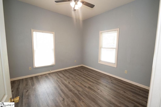 112 Garrison St, Easley, SC 29640 - empty room featuring healthy amount of natural light, dark wood-style floors, and a ceiling fan