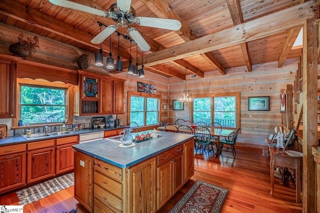 512 Doe Run, Pickens, SC 29671 - kitchen with a wood ceiling with exposed beams, dark countertops, light wood finished floors, wooden walls, and brown cabinets