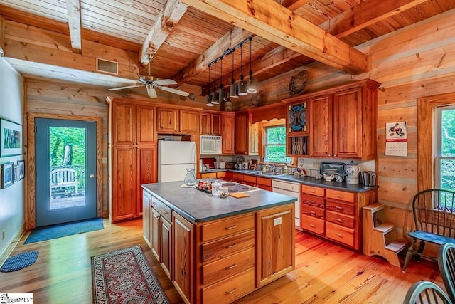 512 Doe Run, Pickens, SC 29671 - kitchen featuring white appliances, a wood ceiling with exposed beams, dark countertops, wood walls, and brown cabinetry
