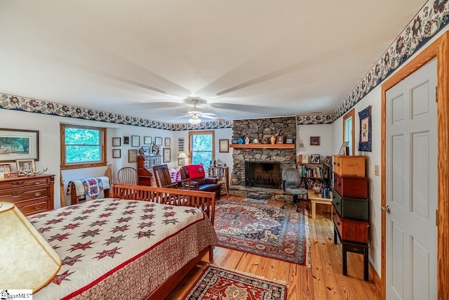 512 Doe Run, Pickens, SC 29671 - bedroom with multiple windows, wood finished floors, a fireplace, and ceiling fan
