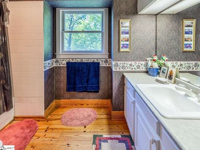 512 Doe Run, Pickens, SC 29671 - bathroom with vanity, wallpapered walls, wood finished floors, and a shower with curtain
