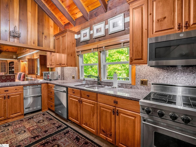 980 Mountain Forest Dr, Union Mills, NC 28167 - kitchen with stainless steel appliances, a wooden ceiling with exposed beams, decorative backsplash, dark stone counters, and brown cabinets