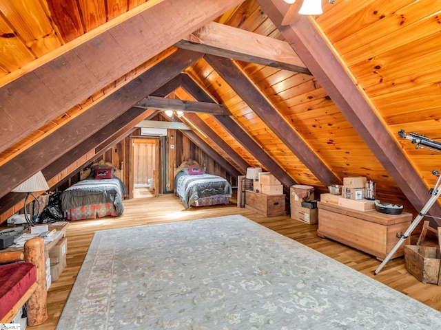 980 Mountain Forest Dr, Union Mills, NC 28167 - bedroom featuring vaulted ceiling, a wall mounted air conditioner, and wood finished floors
