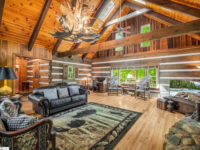 980 Mountain Forest Dr, Union Mills, NC 28167 - living room featuring wood walls, high vaulted ceiling, hardwood / wood-style flooring, a wood ceiling with exposed beams, and a chandelier