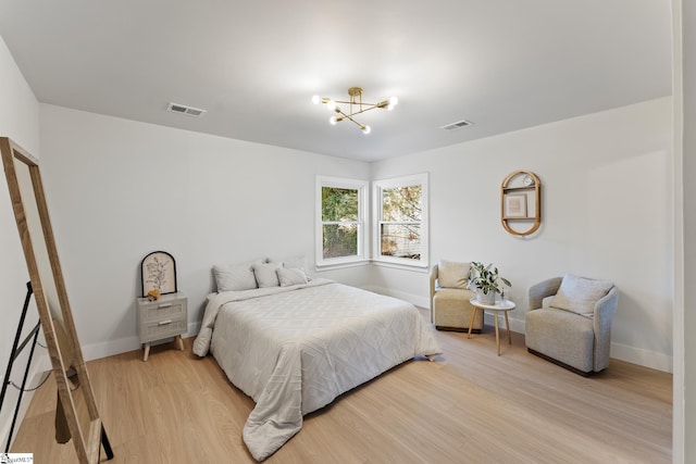 3209 Howland Dr, Anderson, SC 29626 - bedroom featuring a chandelier and light wood-style floors
