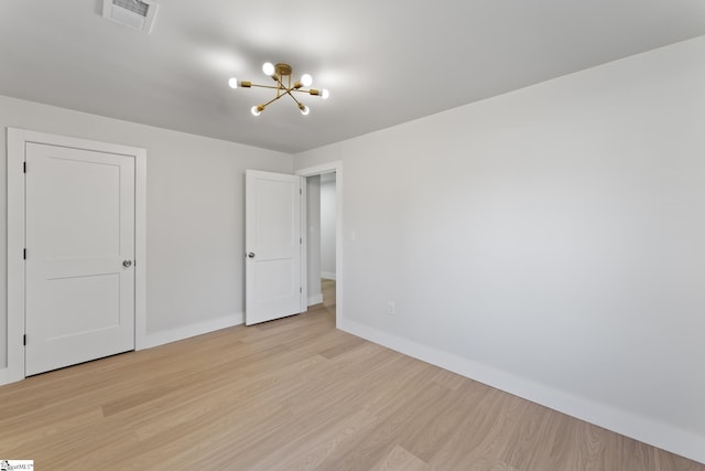 3209 Howland Dr, Anderson, SC 29626 - spare room featuring a chandelier and light wood finished floors