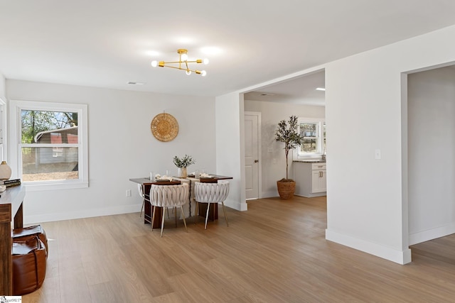 3209 Howland Dr, Anderson, SC 29626 - dining space featuring light wood finished floors and a chandelier