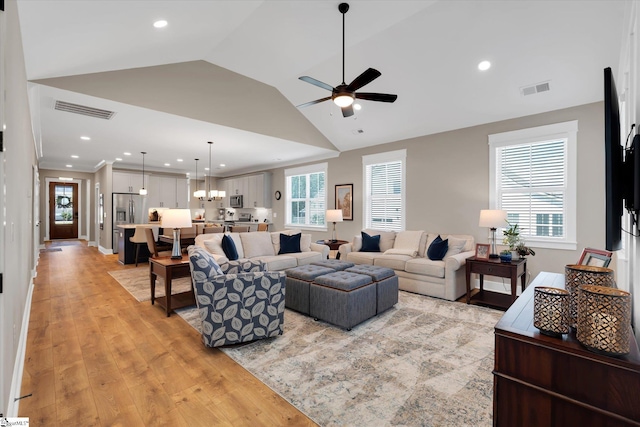 216 Deerview Trl, Simpsonville, SC 29680 - living room featuring a ceiling fan, light wood-style floors, lofted ceiling, recessed lighting, and a chandelier
