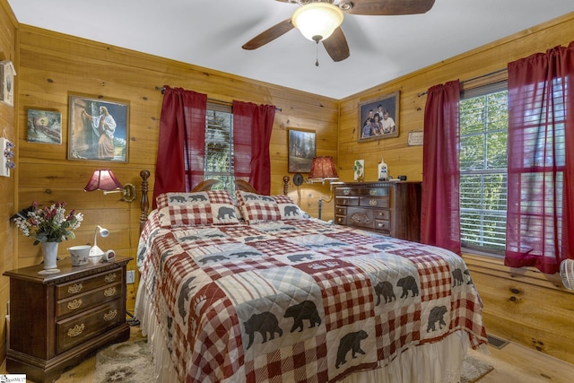 495 Pleasant Grove Rd, Pickens, SC 29671 - bedroom with wooden walls, ceiling fan, and wood finished floors