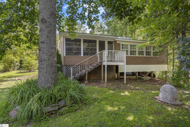 495 Pleasant Grove Rd, Pickens, SC 29671 - view of front of home featuring a sunroom, stairs, and a front lawn
