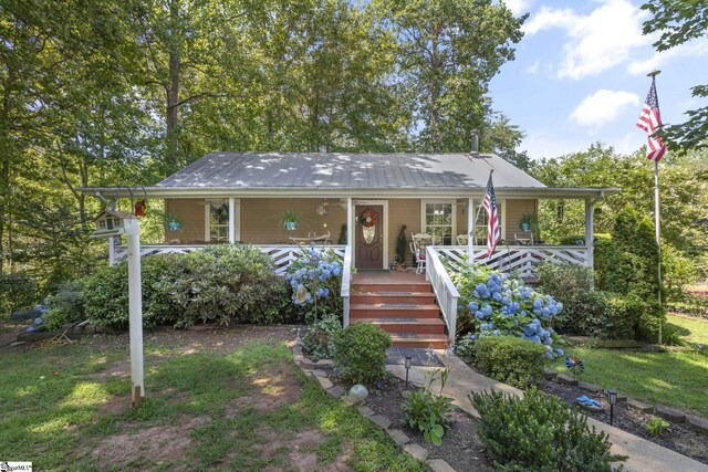 495 Pleasant Grove Rd, Pickens, SC 29671 - view of front of home featuring covered porch and a metal roof