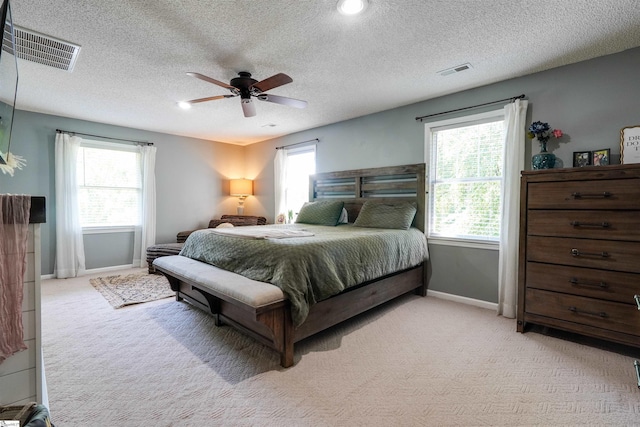 213 Quail Creek Dr, Pickens, SC 29657 - bedroom with light colored carpet, multiple windows, ceiling fan, and a textured ceiling