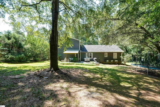 213 Quail Creek Dr, Pickens, SC 29657 - view of grassy yard with a trampoline and view of scattered trees