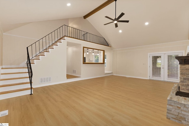 301 Thornwood Dr, Taylors, SC 29687 - unfurnished living room featuring stairway, wood finished floors, beamed ceiling, a ceiling fan, and high vaulted ceiling