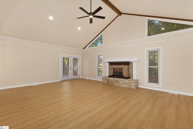 301 Thornwood Dr, Taylors, SC 29687 - unfurnished living room with high vaulted ceiling, light wood-style flooring, a ceiling fan, a fireplace, and beam ceiling