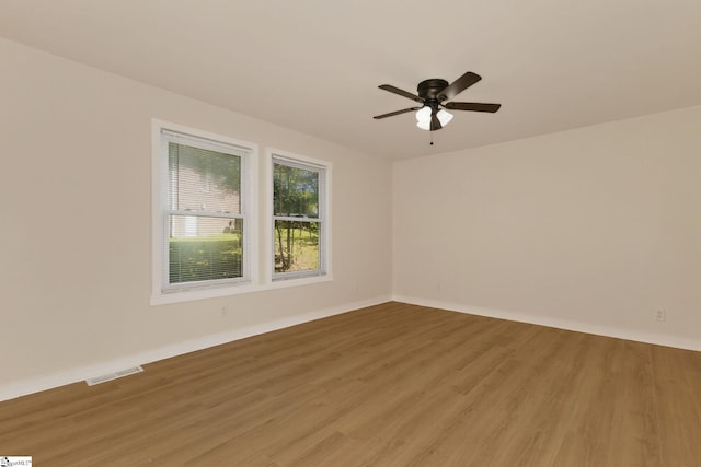 301 Thornwood Dr, Taylors, SC 29687 - empty room with light wood-style floors and ceiling fan