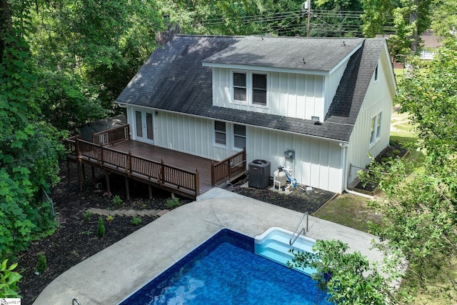 301 Thornwood Dr, Taylors, SC 29687 - rear view of property with a shingled roof, a wooden deck, an outdoor pool, board and batten siding, and a patio area