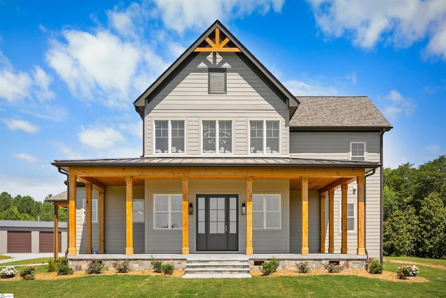 621 Bascule Ridge Ln, Campobello, SC 29322 - view of front facade featuring a standing seam roof, covered porch, a front yard, a metal roof, and a shingled roof