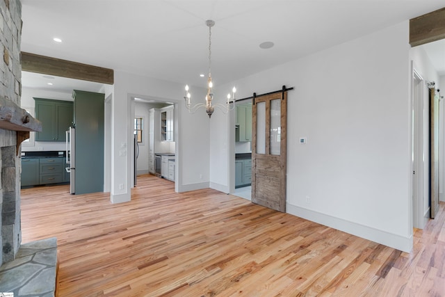 621 Bascule Ridge Ln, Campobello, SC 29322 - unfurnished dining area with a barn door, light wood-type flooring, a chandelier, and recessed lighting