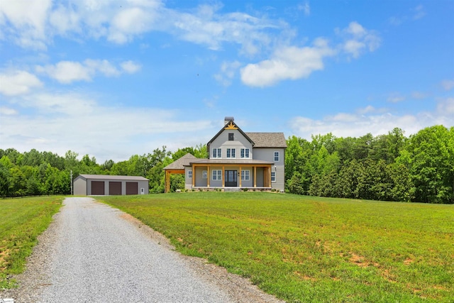 621 Bascule Ridge Ln, Campobello, SC 29322 - view of front facade featuring an outbuilding, a garage, a front yard, a chimney, and gravel driveway