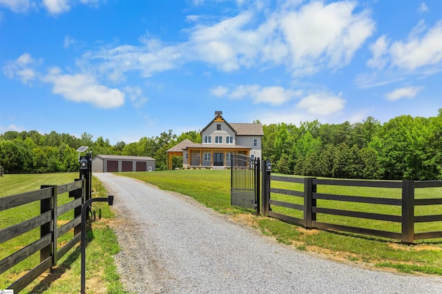 621 Bascule Ridge Ln, Campobello, SC 29322 - view of front of property with a fenced front yard, an outdoor structure, a detached garage, and a chimney