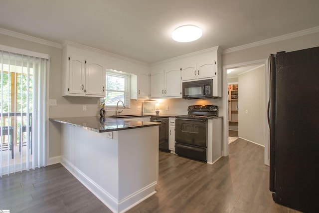 214 Cedar Cir, Easley, SC 29642 - kitchen featuring black appliances, a peninsula, white cabinetry, dark wood-style flooring, and crown molding