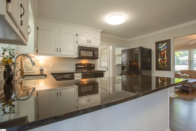 214 Cedar Cir, Easley, SC 29642 - kitchen with black appliances, white cabinetry, ornamental molding, dark stone countertops, and dark wood-style flooring