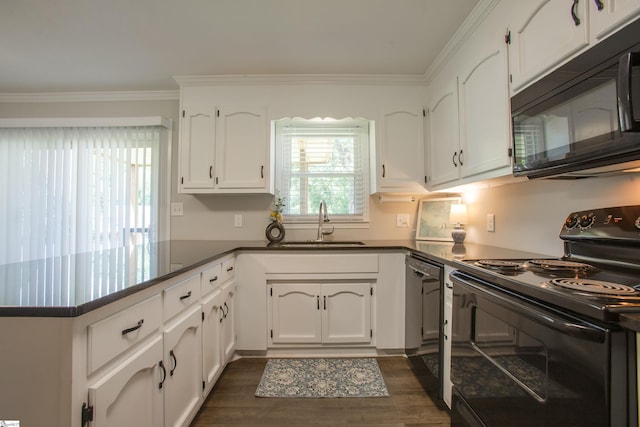 214 Cedar Cir, Easley, SC 29642 - kitchen with black appliances, a peninsula, dark countertops, white cabinets, and ornamental molding