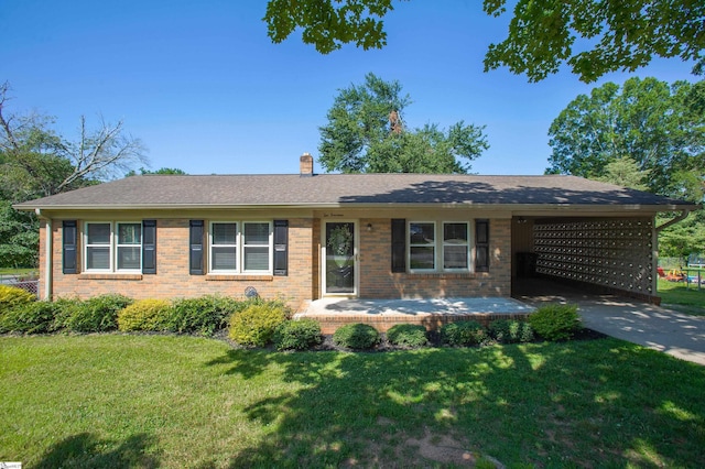 214 Cedar Cir, Easley, SC 29642 - ranch-style house featuring a chimney, a front lawn, brick siding, a carport, and concrete driveway