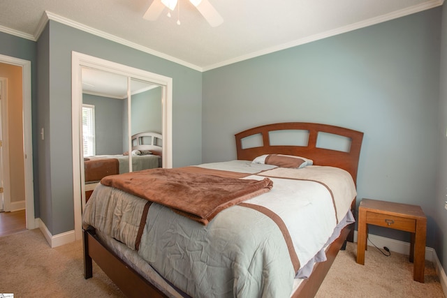 214 Cedar Cir, Easley, SC 29642 - bedroom with light carpet, ornamental molding, ceiling fan, and a closet