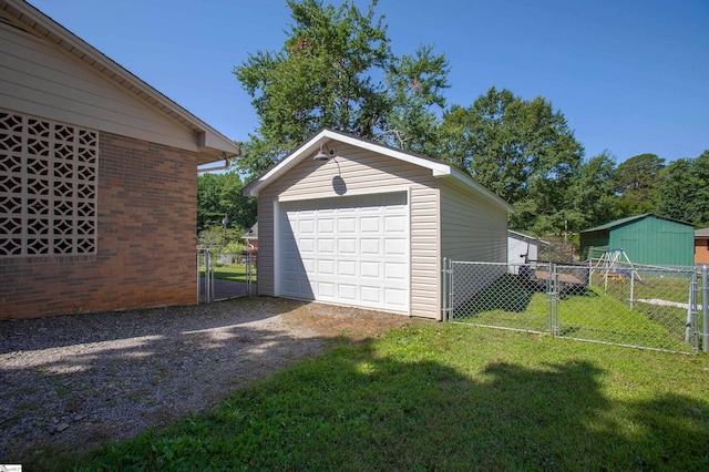 214 Cedar Cir, Easley, SC 29642 - detached garage featuring a gate and dirt driveway