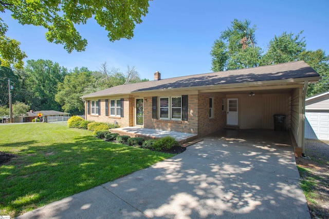 214 Cedar Cir, Easley, SC 29642 - ranch-style home with concrete driveway, a front lawn, an attached carport, a chimney, and brick siding