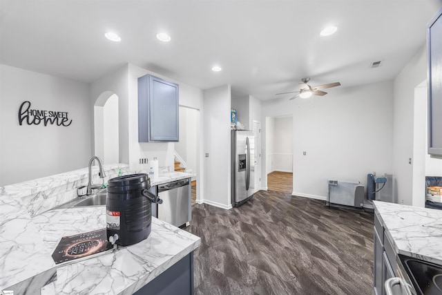 508 Fieldgate Ct, Mauldin, SC 29662 - kitchen featuring appliances with stainless steel finishes, ceiling fan, arched walkways, recessed lighting, and light stone countertops