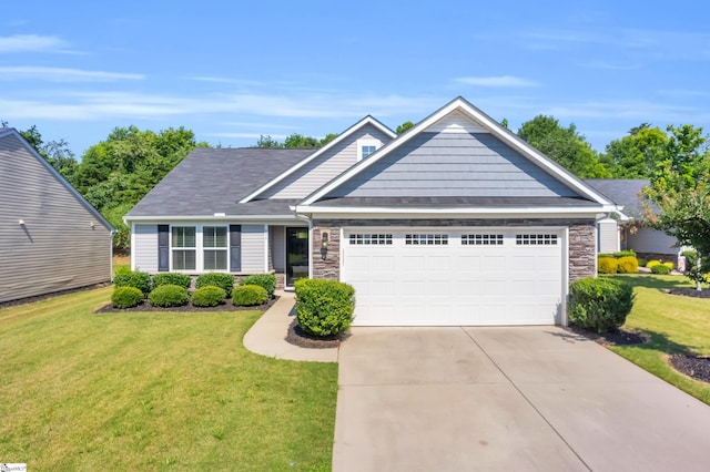 639 Lynndale Ct, Greenville, SC 29617 - craftsman house with stone siding, an attached garage, concrete driveway, and a front lawn