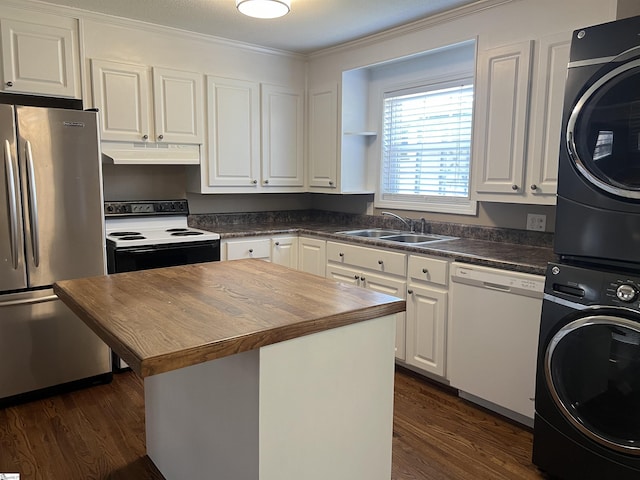 18 Maywood Dr, Taylors, SC 29687 - kitchen featuring white appliances, stacked washing machine and dryer, dark wood-style flooring, wood counters, and crown molding