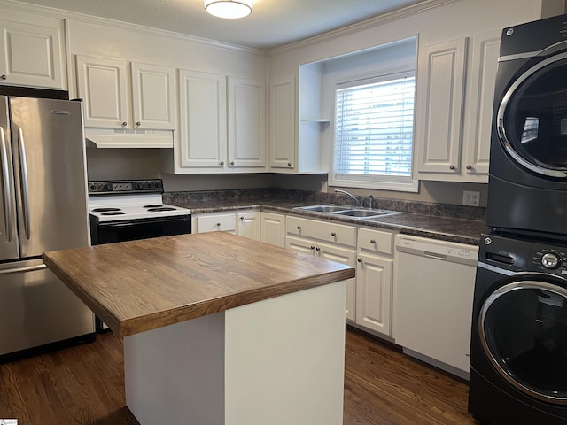 18 Maywood Dr, Taylors, SC 29687 - kitchen featuring white appliances, under cabinet range hood, stacked washer and clothes dryer, butcher block counters, and dark wood finished floors